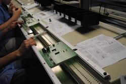 Picture of circuit board assembly by RBB employees