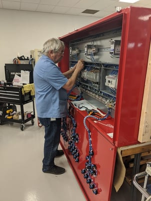 RBB Man working on box build Blog 17.2